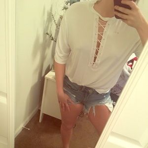 A white shirt sleeve lace up detail shirt